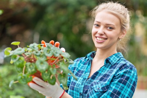 Front view of a gardener assessing a residential garden